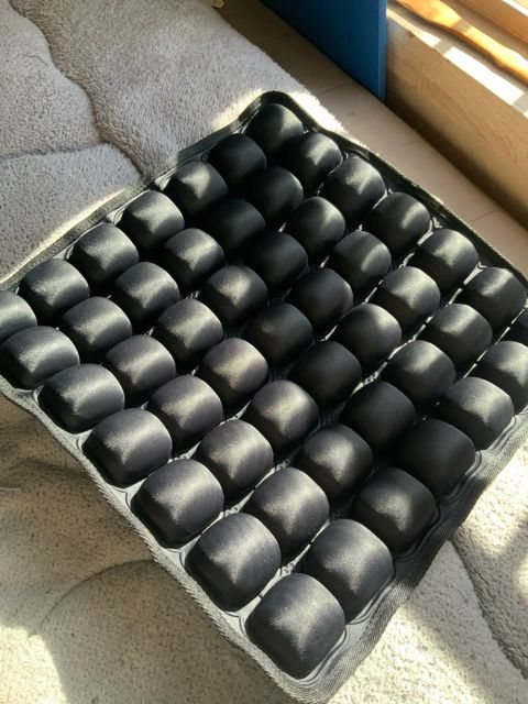 Buyer photo: the cushion inflated on a sofa