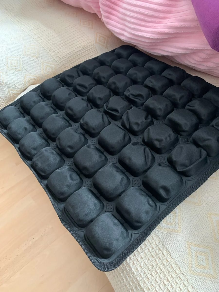 Buyer photo: the cushion on a bed